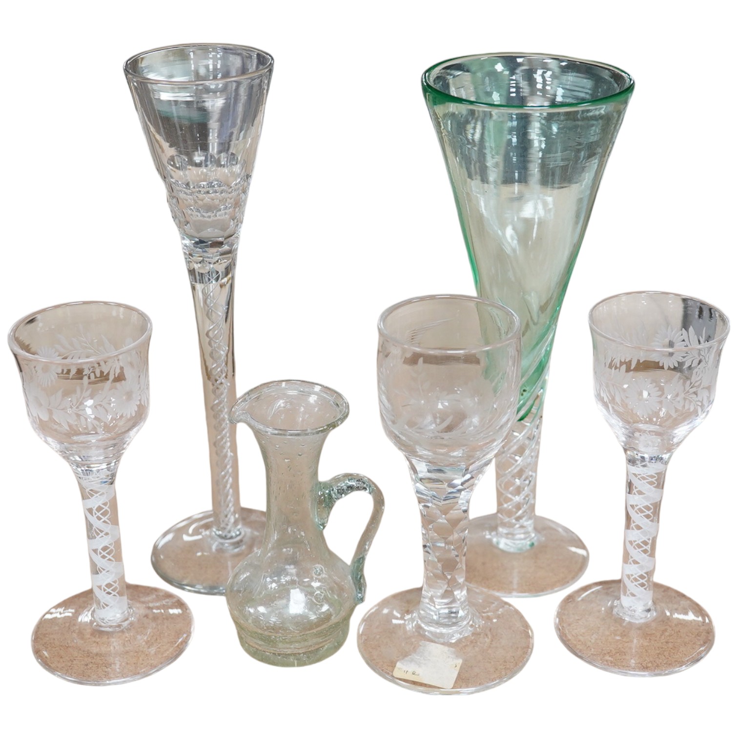 Five 18th / 19th century style wine and cordial glasses, some with air twist stems, together with a jug, largest 23cm high. Condition - good